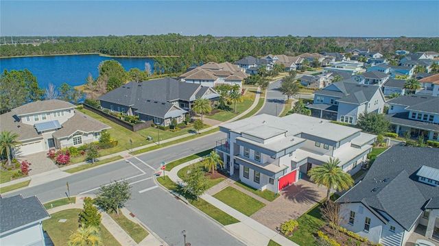 birds eye view of property with a water view