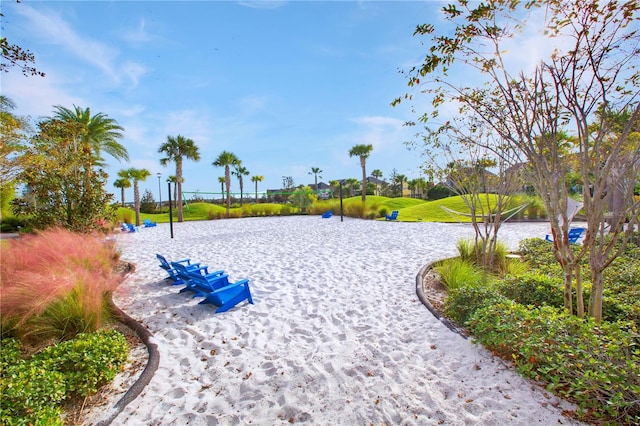 view of home's community featuring volleyball court