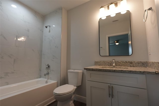 full bathroom with vanity, toilet, and tiled shower / bath