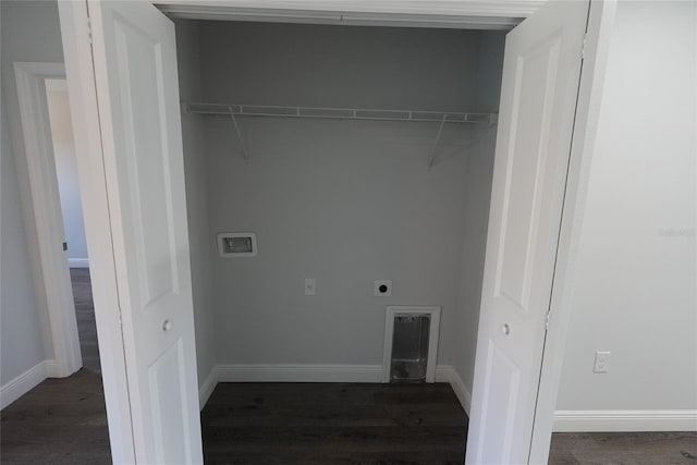 washroom with dark hardwood / wood-style floors and hookup for an electric dryer