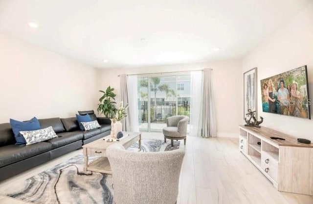 living room with light hardwood / wood-style flooring