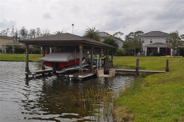 view of dock featuring a yard and a water view