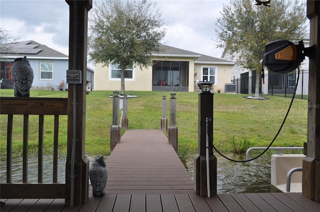 exterior space featuring cooling unit and a lawn