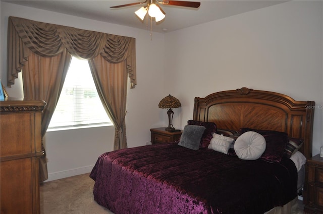 bedroom featuring light carpet and ceiling fan