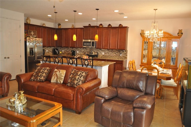 tiled living room with a chandelier