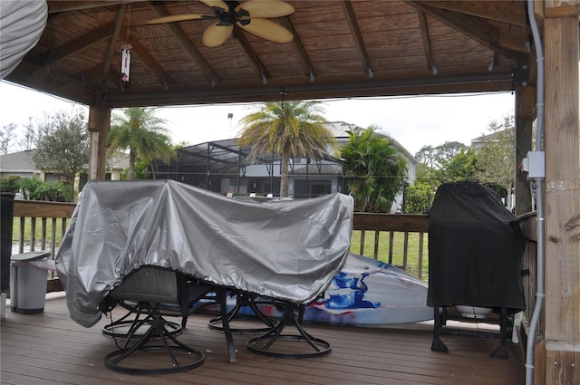 wooden deck featuring a gazebo and area for grilling