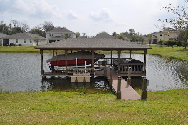 view of dock featuring a water view and a lawn