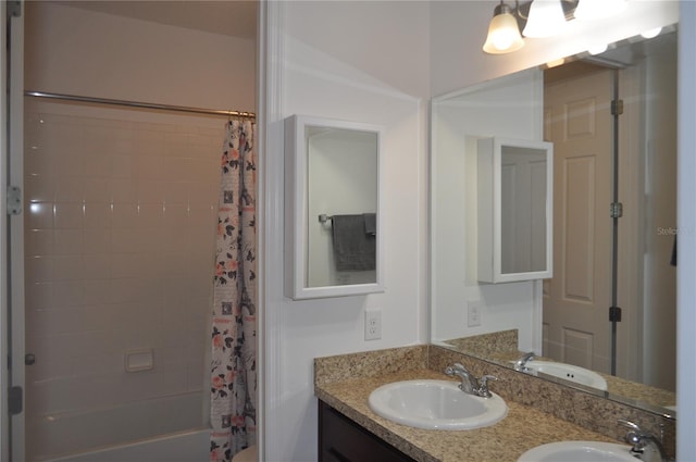 bathroom with vanity and shower / bath combo