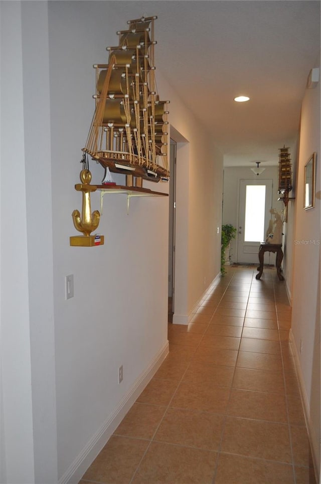 corridor with tile patterned flooring