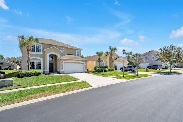 view of front of home featuring a front yard and a garage