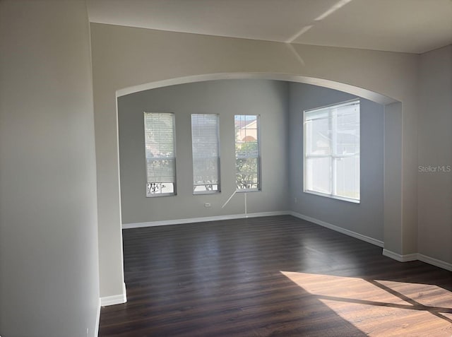 spare room featuring dark hardwood / wood-style floors