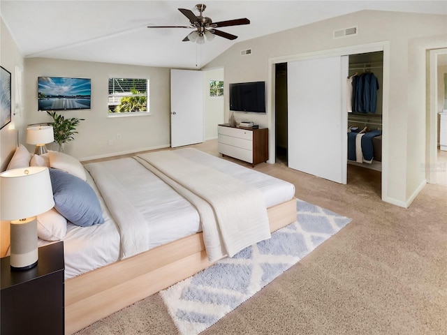 carpeted bedroom with ceiling fan and lofted ceiling