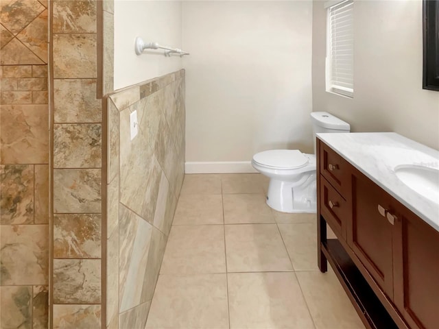 bathroom with tile patterned floors, vanity, and toilet