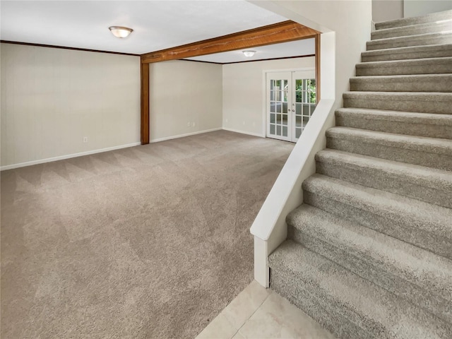 stairs featuring french doors, carpet, and beamed ceiling