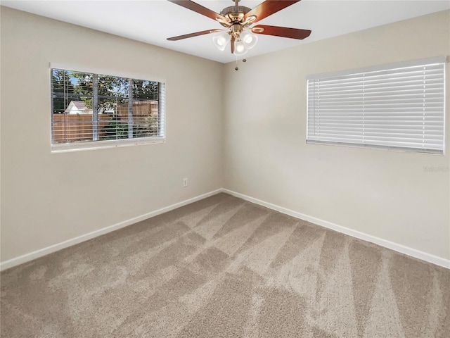 empty room with carpet and ceiling fan