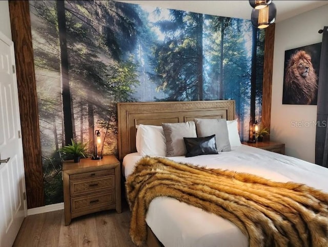 bedroom featuring wood-type flooring