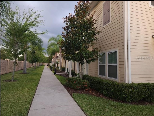 view of home's exterior with a lawn