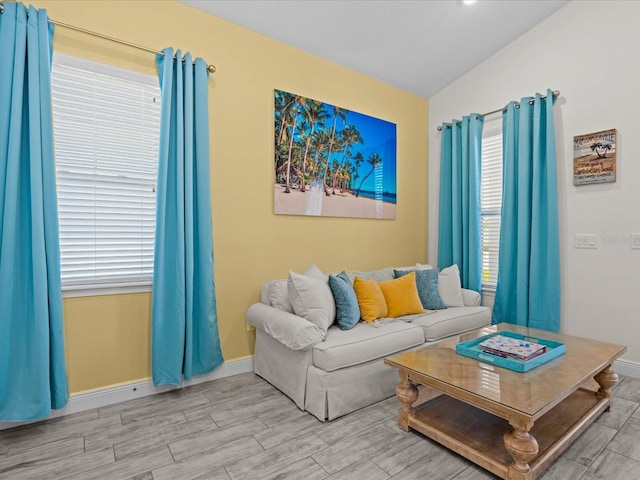 living room featuring lofted ceiling