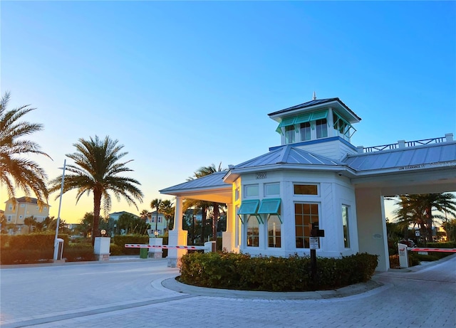 view of outdoor building at dusk