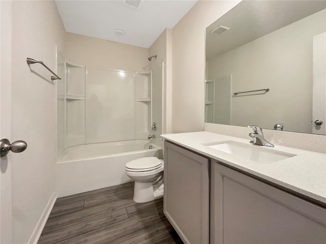 full bathroom with shower / bath combination, hardwood / wood-style flooring, vanity, and toilet