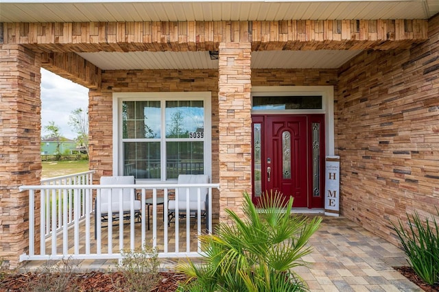 doorway to property with covered porch