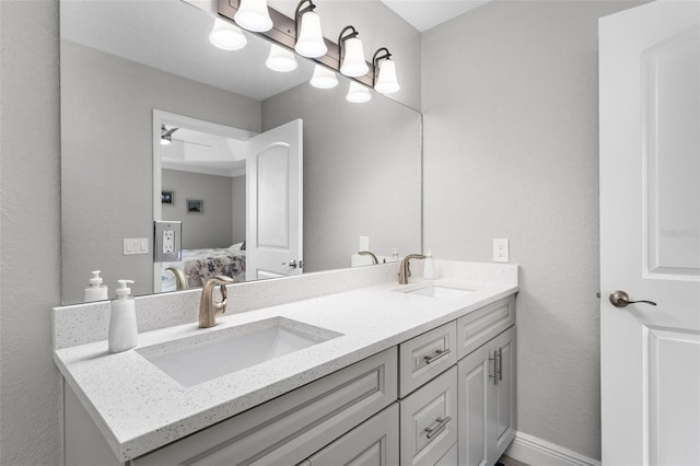 bathroom featuring large vanity and double sink