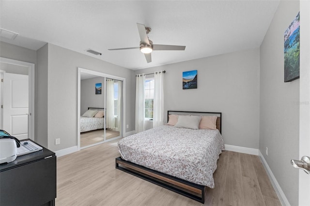 bedroom featuring ceiling fan and light hardwood / wood-style flooring