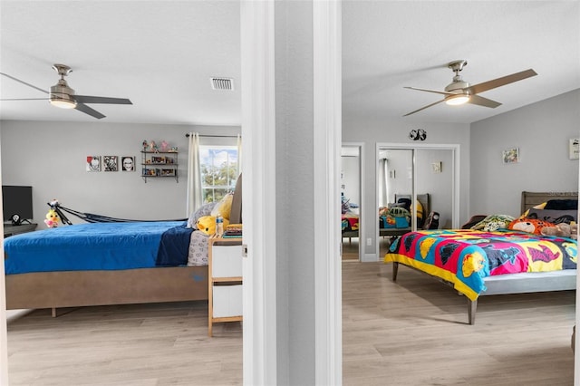 bedroom featuring ceiling fan and light wood-type flooring