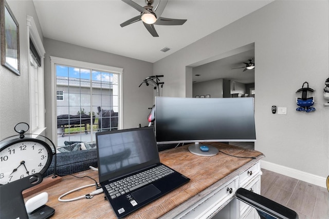 office with ceiling fan and light hardwood / wood-style flooring