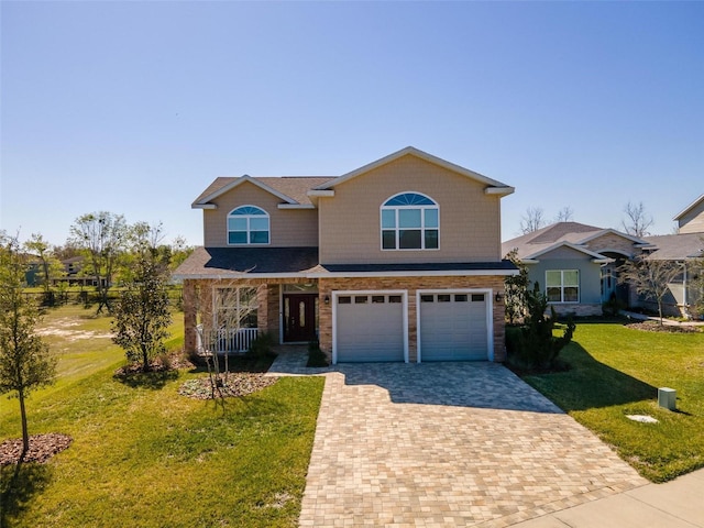 front of property with a front yard and a garage