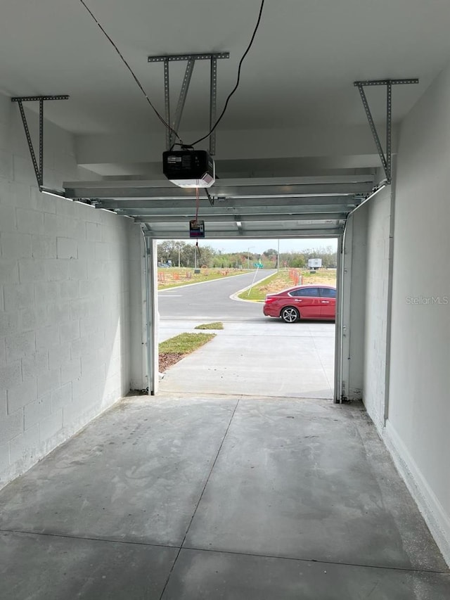 garage featuring a carport and a garage door opener