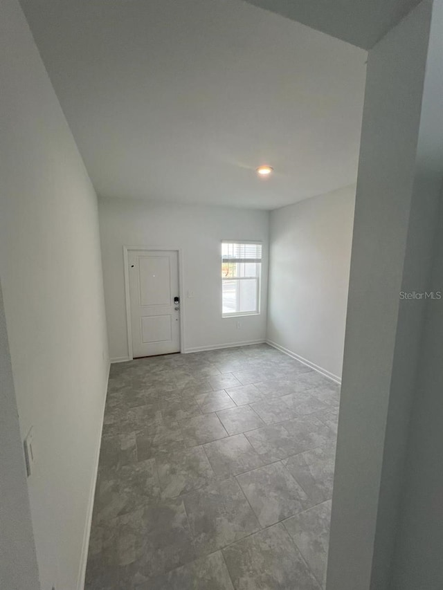 spare room with light tile flooring