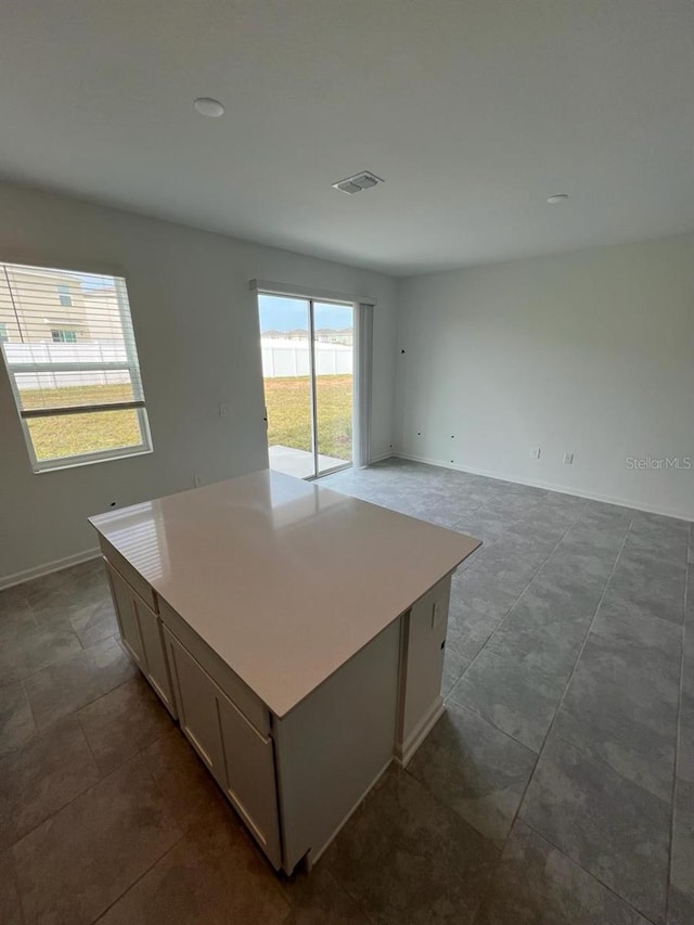 interior space featuring a center island and tile floors