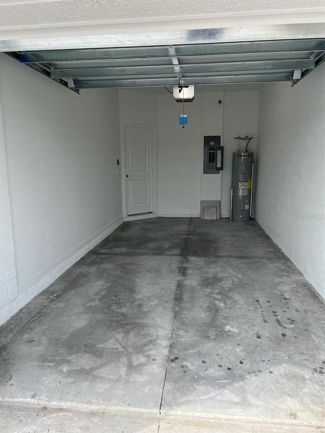 garage featuring electric water heater and a garage door opener