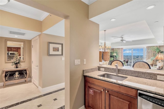 kitchen featuring light stone countertops, ceiling fan with notable chandelier, sink, stainless steel appliances, and light tile floors