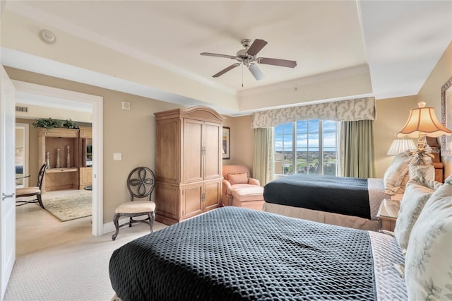 bedroom featuring light carpet, ornamental molding, and ceiling fan