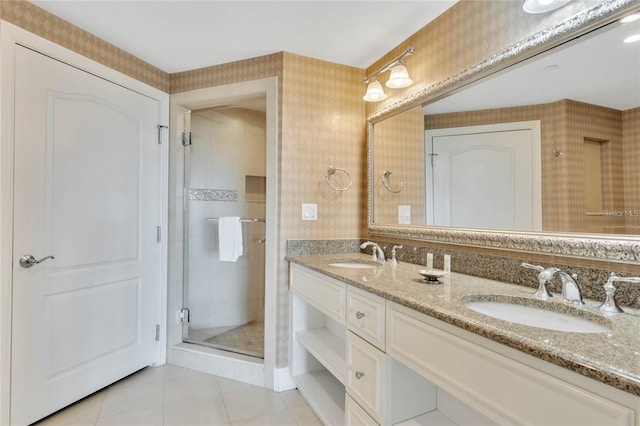 bathroom with walk in shower, tile floors, double sink, and large vanity