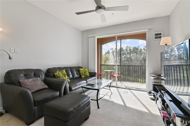 carpeted living room with ceiling fan