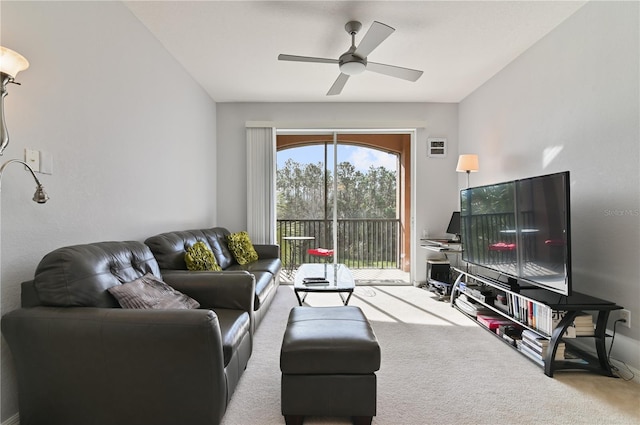 living room with light carpet and ceiling fan