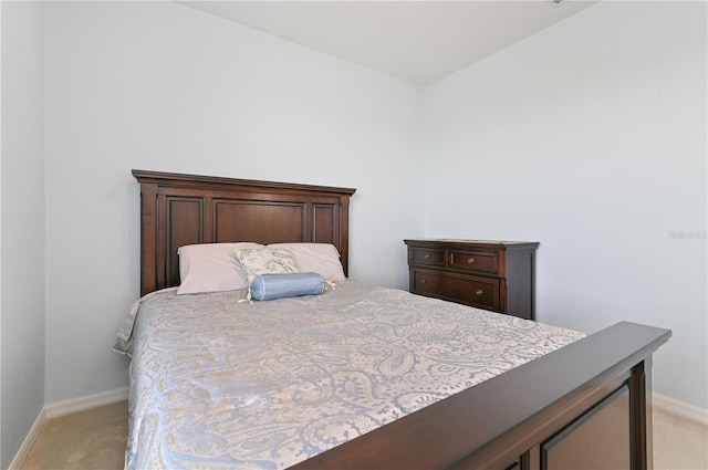 bedroom featuring light colored carpet