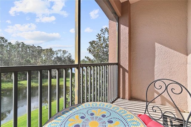 balcony featuring a water view