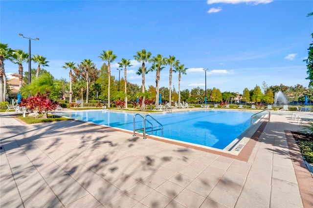 view of swimming pool with a patio