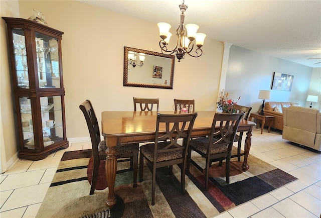 tiled dining area with a notable chandelier