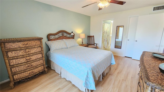 bedroom with ceiling fan and light hardwood / wood-style flooring