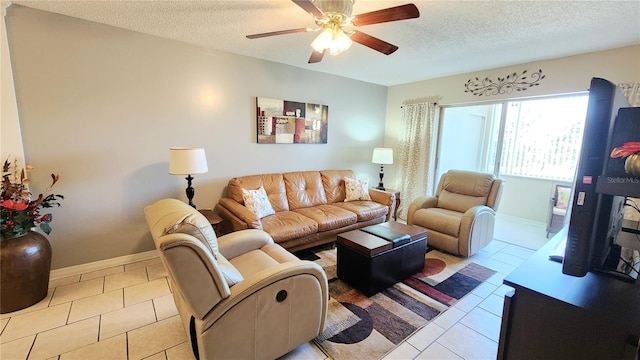 tiled living room with a textured ceiling and ceiling fan