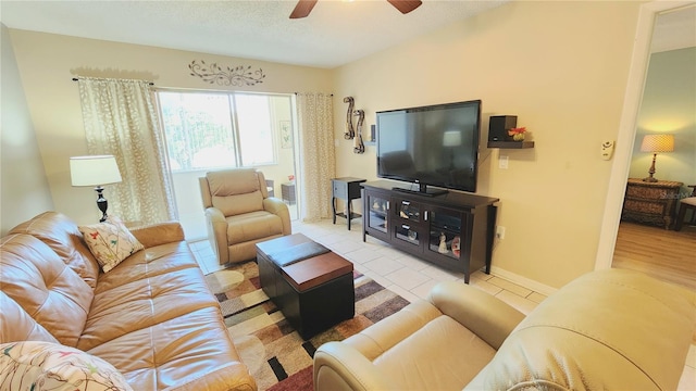 living room with ceiling fan and light wood-type flooring