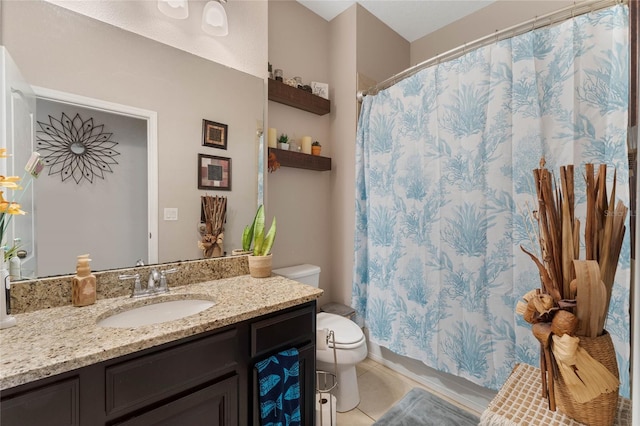 bathroom with toilet, vanity, tile patterned flooring, and walk in shower