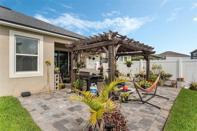 view of patio with grilling area and a pergola