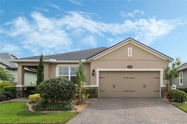 ranch-style house featuring a garage