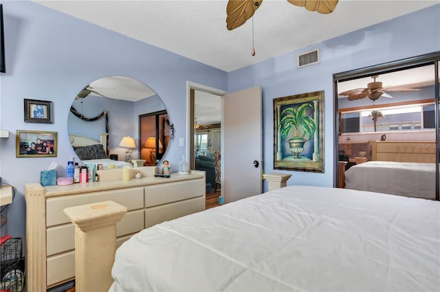 bedroom with wood-type flooring and ceiling fan